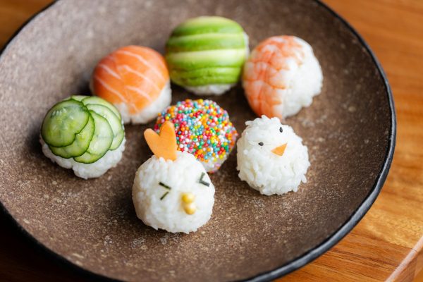 Chef teaching how to make sushi